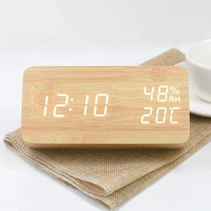 Versatile wooden alarm clock with humidity sensor and silent mode for baby's nursery