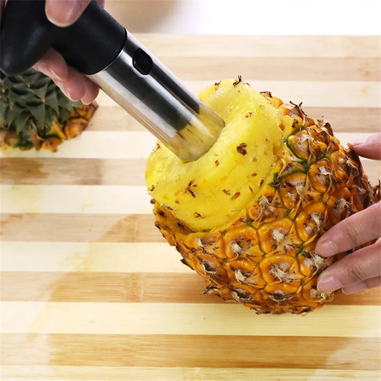 Stainless steel pineapple slicer with ergonomic handle and height markings for effortless fruit prep