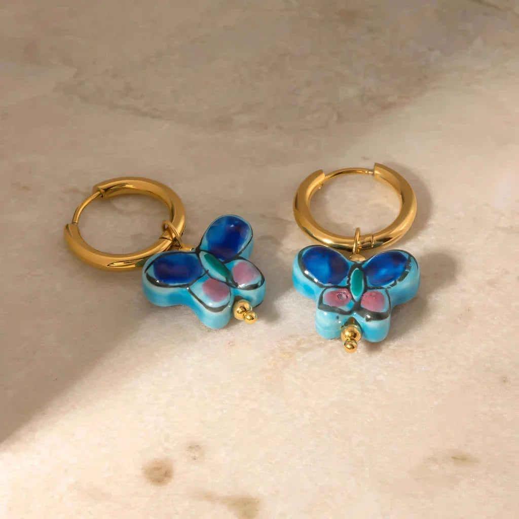 Premium 18K gold plated stainless steel blue flower and butterfly ceramic stud earrings, a stylish accessory crafted in New Zealand